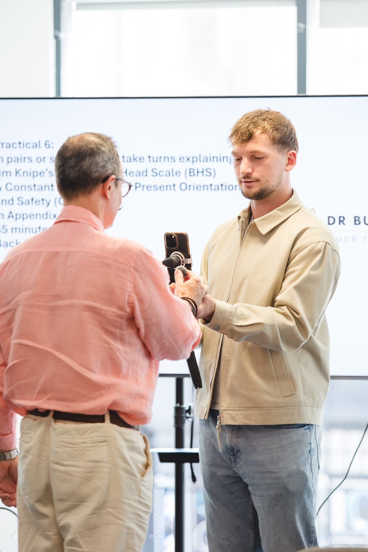 Setting up a filming rig with a trainer before an EMDR practical session